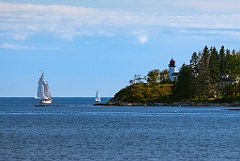 Sailboats Pass Burnt Island Lighthouse in Maine